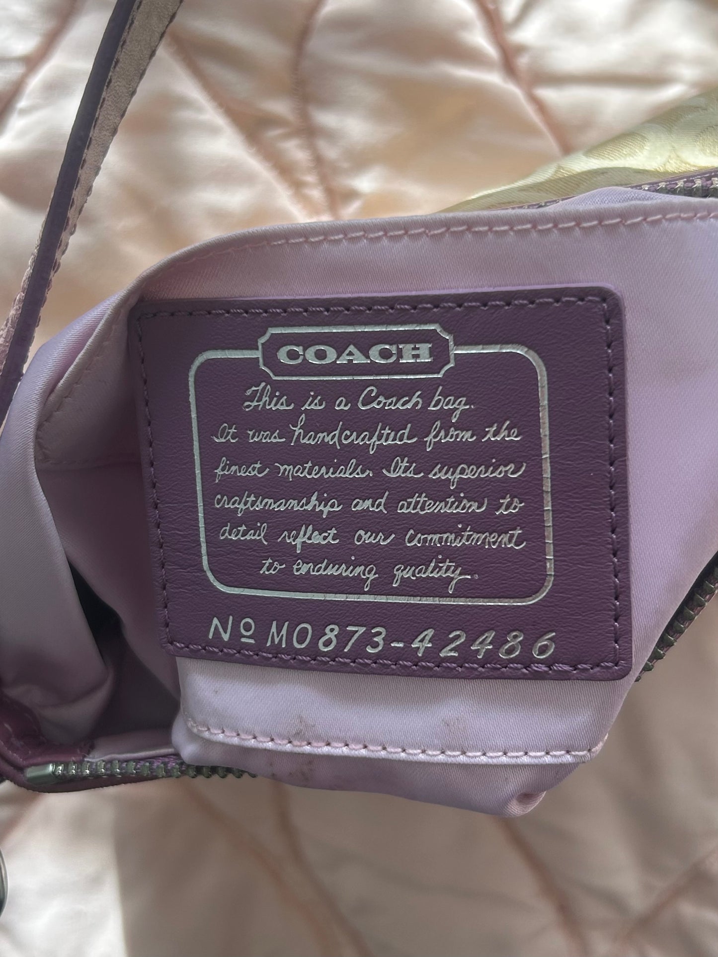 Coach shoulder bag flower appliqué